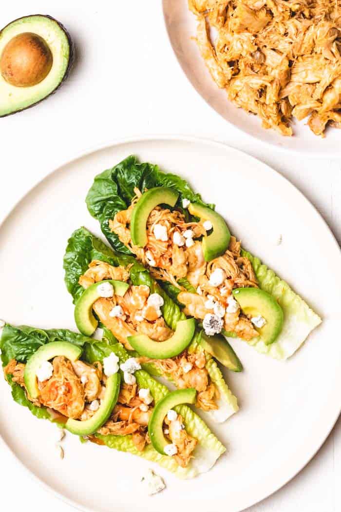 shredded buffalo chicken served in lettuce wraps with condiments