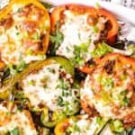 keto stuffed peppers in a casserole dish with cheese